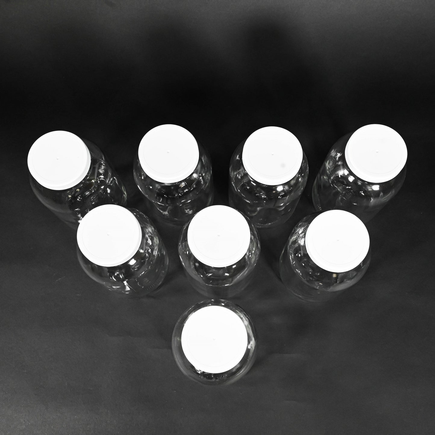 Eight glass bottles with caps