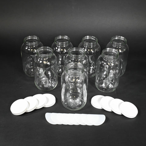 Eight glass bottles with caps and liners