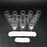 Twelve glass bottles with caps