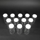 Twelve glass bottles with caps