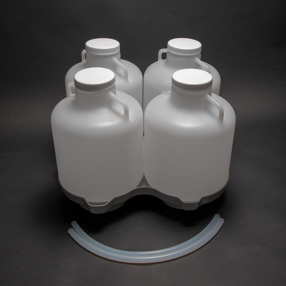 4 polyethylene bottles with caps, locating base and two discharge tubes.