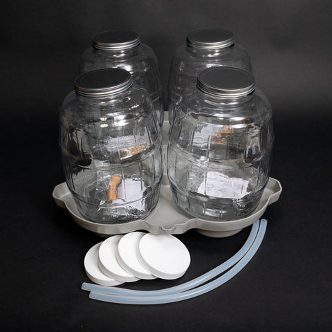 4 glass 2.5 Gallon (10 Liter) bottles with PTFE-lined caps, locating base and two discharge tubes.