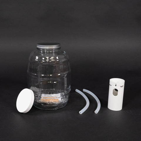 1 glass round bottle with cap, tube guide and two discharge tubes. 