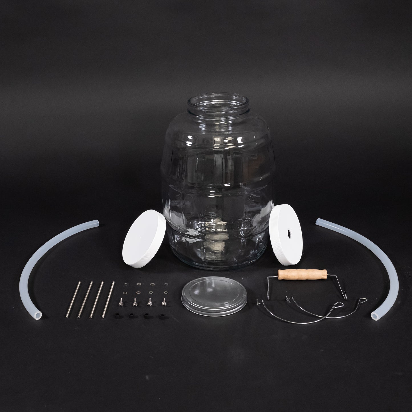 Glass bottle with caps, adapter kit and two discharge tubes. 