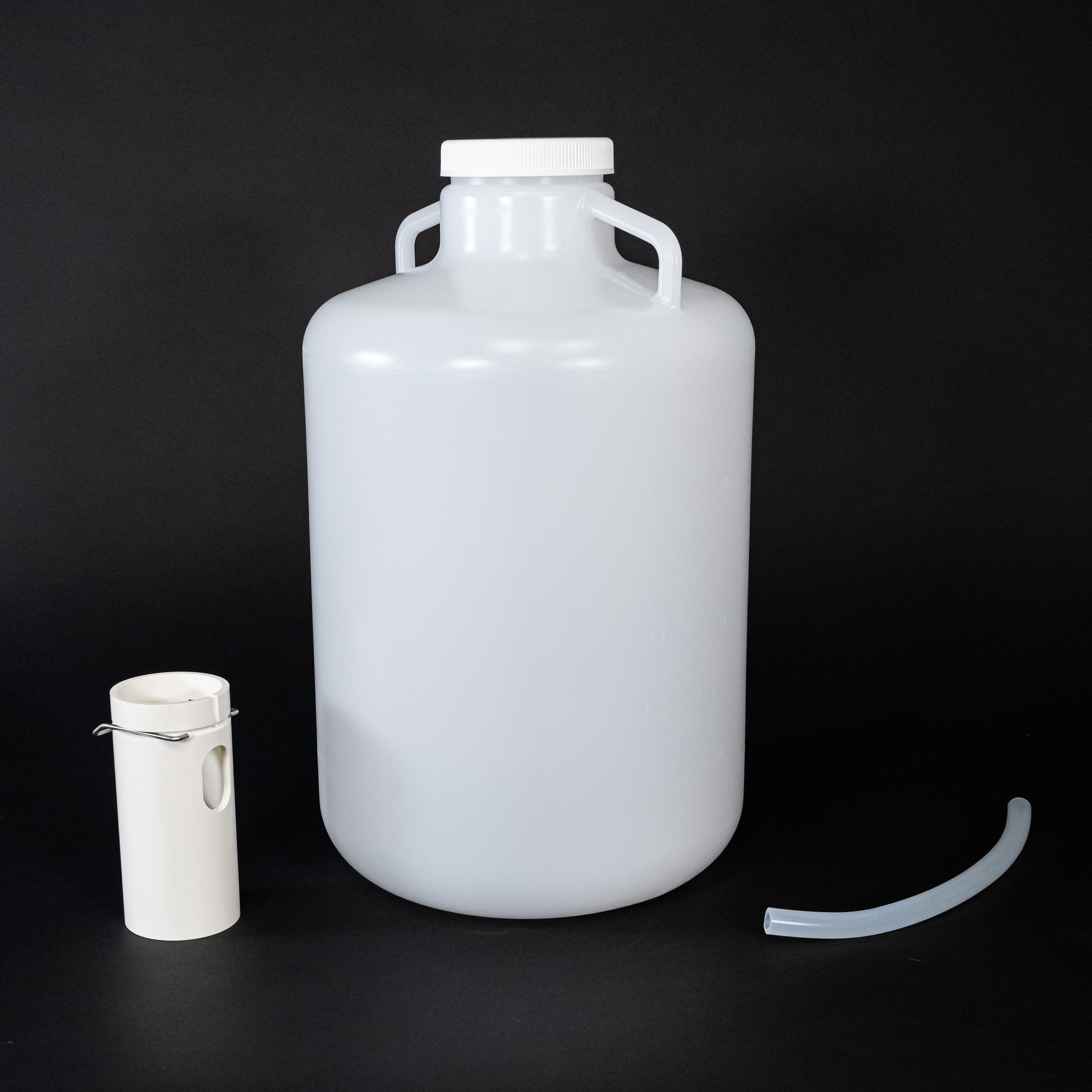 Polyethylene round bottle with cap and two discharge tubes.