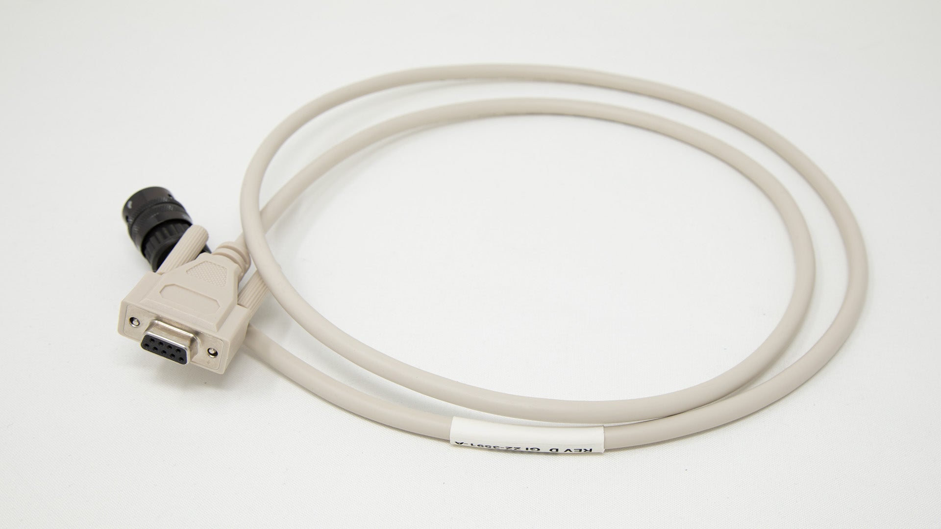 Cable with computer connector at one end and military style connector on other.
