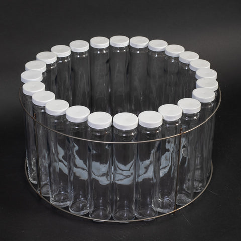24 glass bottles with caps, bottle retaining ring and two discharge tubes.