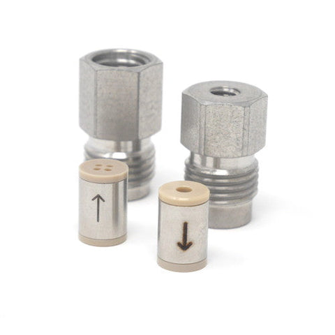 Stainless steel check valves, four separate pieces.