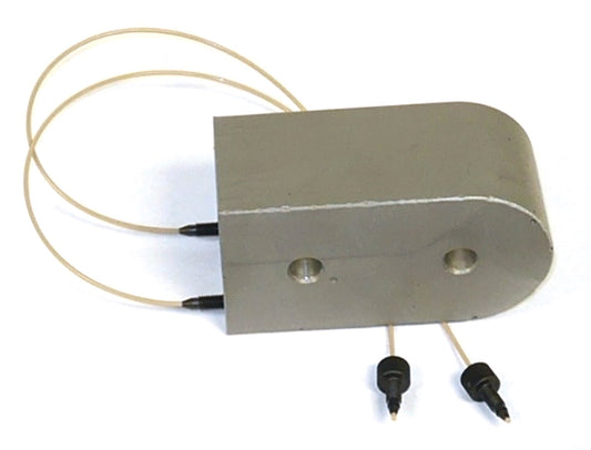 A metal device with a pair of tubes connected, showcasing a compact equipment setup.