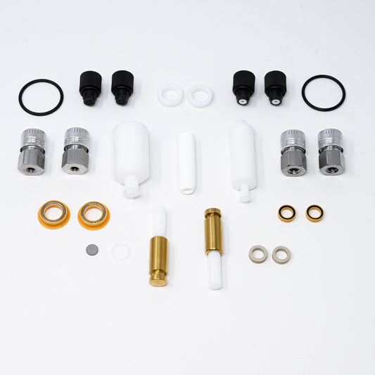 A collection of pump components arranged neatly, showcasing various parts essential for assembly and repair.