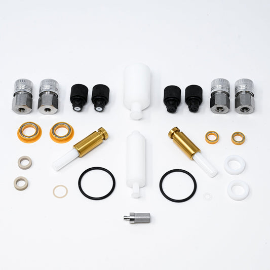 A collection of pump components arranged neatly, showcasing various parts essential for assembly and repair.