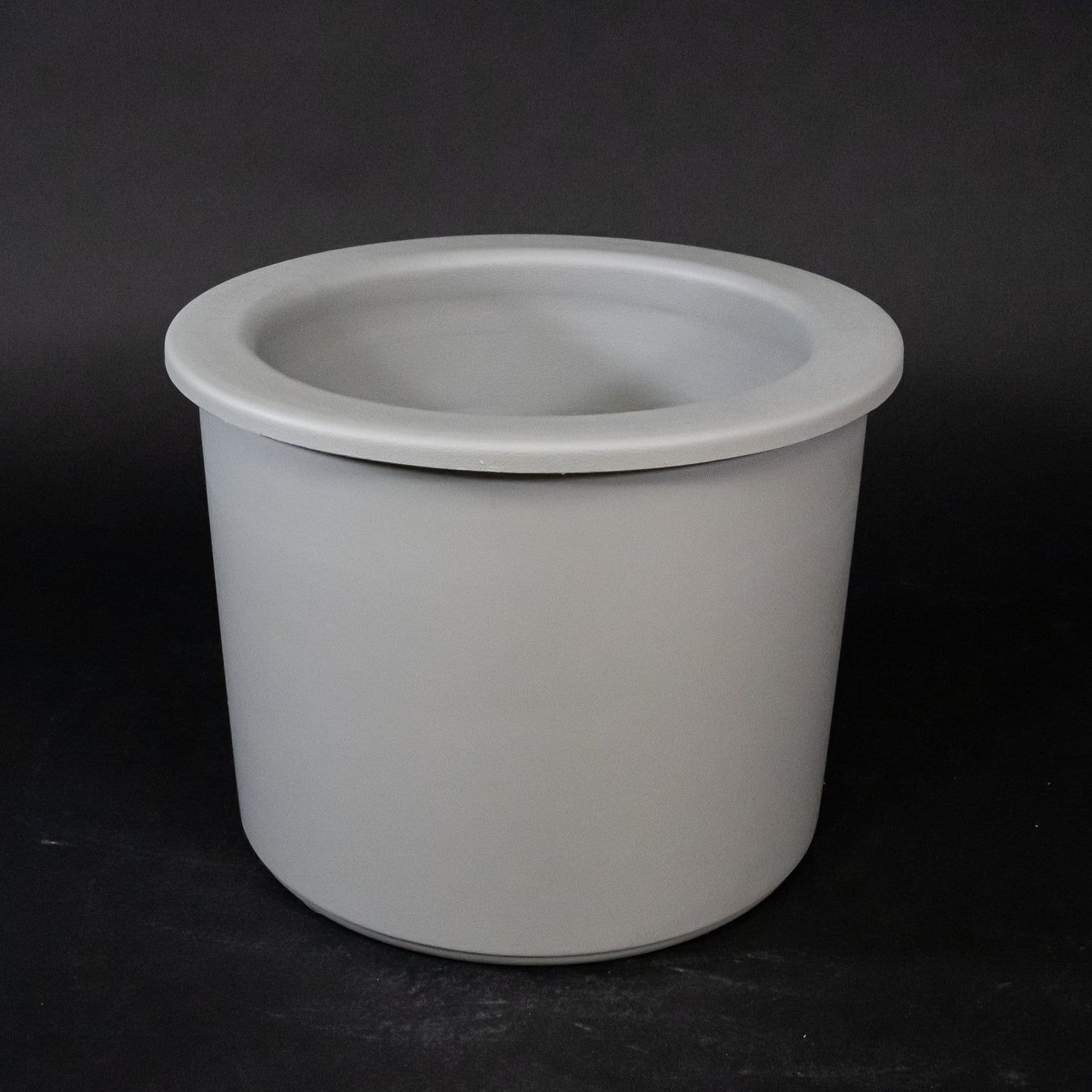 A gray plastic container, suitable for storage and organization purposes.