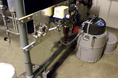 Pressure reduction valve, 3-way ball valve, alarm box, mounting plate, AC line cord.