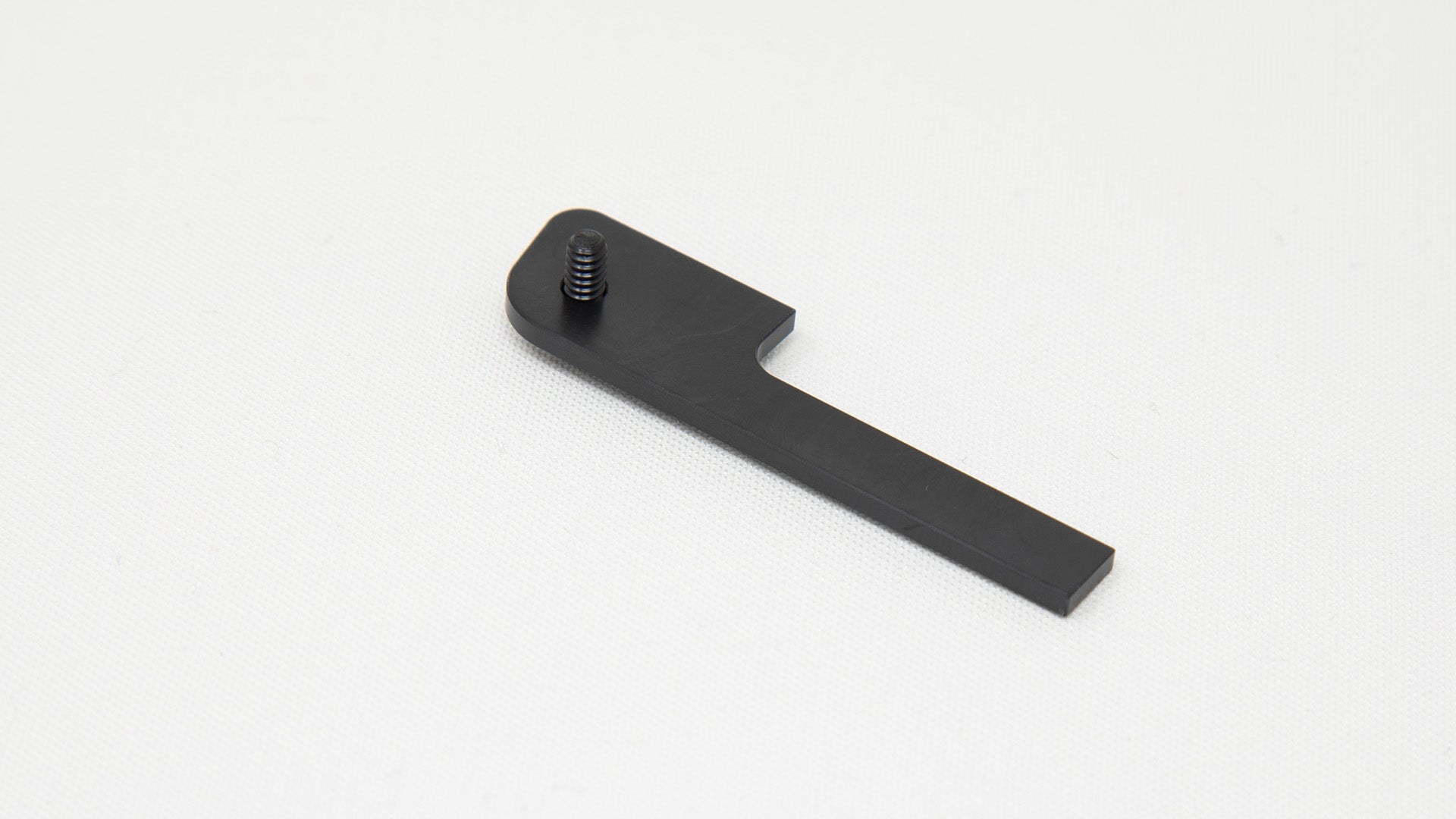 P-shaped plastic piece with screw